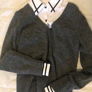 Woman’s gray v-neck sweater